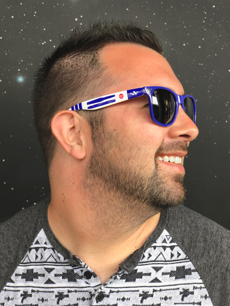 Young-adult male wearing the blue and white astrobot sunglasses