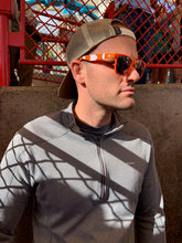 Load image into Gallery viewer, Adult male wearing the orange and white sunglasses 