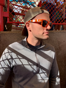 Adult male wearing the orange and white sunglasses 